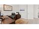 Another view of the home office with wooden desk and rolling office chair at 5004 Waterkey Way, Tampa, FL 33647