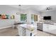 Bright kitchen area with granite countertops, wine rack, and easy access to the backyard pool at 5004 Waterkey Way, Tampa, FL 33647