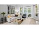 Well-lit living area offering comfortable seating, views of the pool area, and an open transition to the fireplace at 5004 Waterkey Way, Tampa, FL 33647