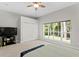 Spacious main bedroom featuring a large window with backyard views and a walk-in closet at 5004 Waterkey Way, Tampa, FL 33647