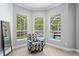 Sitting area in main bedroom with large windows overlooking the pool area at 5004 Waterkey Way, Tampa, FL 33647