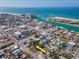 Aerial view of a home in a lovely neighborhood near the beach and coastal waterways at 515 77Th Ave, St Pete Beach, FL 33706