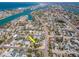 Wide aerial view of a home nestled in a coastal neighborhood with stunning ocean views at 515 77Th Ave, St Pete Beach, FL 33706