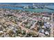 Stunning aerial view of a coastal community with beautiful waterfront homes and clear blue waters at 515 77Th Ave, St Pete Beach, FL 33706