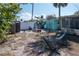 The backyard features a hammock and pavers leading towards the rear of the property at 515 77Th Ave, St Pete Beach, FL 33706