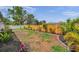Large backyard features a newly installed wood fence, well-maintained landscaping, and ample space for outdoor activities at 5833 Dartmouth N Ave, St Petersburg, FL 33710
