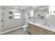 Modern bathroom with double sinks, walk-in shower, and decorative accents at 5833 Dartmouth N Ave, St Petersburg, FL 33710
