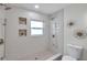 Well-lit bathroom with walk-in shower and unique design elements at 5833 Dartmouth N Ave, St Petersburg, FL 33710