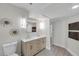 Bright bathroom with dual sink vanity and decorative wall art at 5833 Dartmouth N Ave, St Petersburg, FL 33710