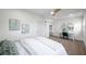 Bedroom with hard floors, ceiling fan, work station with arched mirrors, and closet at 5833 Dartmouth N Ave, St Petersburg, FL 33710