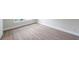 An empty room featuring hard floors, white baseboards, and electrical outlets at 5833 Dartmouth N Ave, St Petersburg, FL 33710