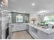 Modern kitchen with stylish countertops, stainless steel appliances, and wood flooring at 5833 Dartmouth N Ave, St Petersburg, FL 33710