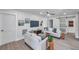 Bright living room with neutral walls, wood floors, and comfortable seating at 5833 Dartmouth N Ave, St Petersburg, FL 33710