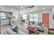 Bright, open living room flows into kitchen with a cozy dining area at 5833 Dartmouth N Ave, St Petersburg, FL 33710