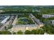 Aerial view of the community with lush trees, waterways, and nearby coastal access at 5849 Park N St # 308, St Petersburg, FL 33709