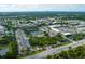 Expansive aerial view of a community with lush greenery, ponds, and townhome-style apartments at 5849 Park N St # 308, St Petersburg, FL 33709