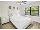 Bedroom featuring laminated floor, ceiling fan and natural light from the windows at 5849 Park N St # 308, St Petersburg, FL 33709