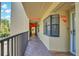 Hallway view featuring elevator access, unit door, and outdoor views at 5849 Park N St # 308, St Petersburg, FL 33709