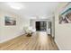 Cozy living room featuring new flooring, natural light, and seamless transitions at 5849 Park N St # 308, St Petersburg, FL 33709