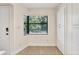 Sunny room featuring tile floors and a corner view, with plenty of storage at 5849 Park N St # 308, St Petersburg, FL 33709