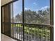 Enclosed lanai with sliding windows overlooking the outdoor greenery at 5849 Park N St # 308, St Petersburg, FL 33709
