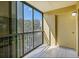 Bright, enclosed sunroom with tile floor providing a relaxing view of the outdoors at 5849 Park N St # 308, St Petersburg, FL 33709
