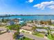 Beautiful aerial view of waterfront homes with lush palm trees lining the streets against a backdrop of the bay at 601 Boca Ciega Isle Dr, St Pete Beach, FL 33706