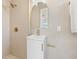 Stylish bathroom with gold fixtures and decorative tile wall at 601 Boca Ciega Isle Dr, St Pete Beach, FL 33706