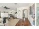 Bright and open living room with hardwood floors, neutral decor, and seamless flow to kitchen at 601 Boca Ciega Isle Dr, St Pete Beach, FL 33706