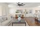 Bright living room boasting hardwood floors, modern furnishings, and an open layout leading to the kitchen at 601 Boca Ciega Isle Dr, St Pete Beach, FL 33706