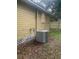 Home exterior with central air conditioner and fenced backyard at 6200 N 44Th St, Tampa, FL 33610