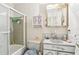 Well-lit bathroom with a shower-tub combo and painted vanity, providing a clean and functional space at 6544 S West Shore Cir, Tampa, FL 33616