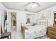 Bright bedroom with tiled floor, floral accents, and a closet, offering comfort and functionality at 6544 S West Shore Cir, Tampa, FL 33616