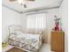 Well-lit bedroom featuring a tiled floor and closet, offering comfort and functionality at 6544 S West Shore Cir, Tampa, FL 33616