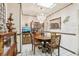 Cozy dining area with stylish chandelier, tile floors, and classic furnishings at 6544 S West Shore Cir, Tampa, FL 33616