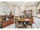 Elegant dining area featuring a stylish chandelier, wooden table, and tiled flooring at 6544 S West Shore Cir, Tampa, FL 33616