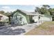Charming single-story home featuring a covered carport and well-maintained landscaping at 6544 S West Shore Cir, Tampa, FL 33616