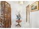 Inviting foyer featuring a decorative folding screen, tile flooring, and chandelier at 6544 S West Shore Cir, Tampa, FL 33616