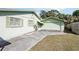 Garage, driveway and green exterior at 6544 S West Shore Cir, Tampa, FL 33616