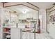 Efficient kitchen area with white cabinetry, tile flooring, and practical layout at 6544 S West Shore Cir, Tampa, FL 33616