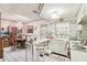 Bright eat-in kitchen area with tile floors, white cabinets, and modern lighting at 6544 S West Shore Cir, Tampa, FL 33616