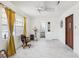 Spacious living room with tiled floors, natural light, and neutral walls, perfect for relaxation and entertaining at 6544 S West Shore Cir, Tampa, FL 33616