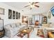 Spacious living room featuring tile floors, comfortable seating, and natural lighting at 6544 S West Shore Cir, Tampa, FL 33616
