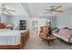 Spacious bedroom with neutral carpet, ornate furniture, ceiling fans, and closet at 7110 N Rome Ave, Tampa, FL 33604