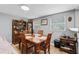 Charming dining room with classic wooden table and chairs, adjacent to the living area at 7110 N Rome Ave, Tampa, FL 33604