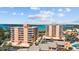 Aerial view showcasing condo buildings with balconies offering stunning water views at 7430 Sunshine Skyway S Ln # 402, St Petersburg, FL 33711