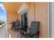 Balcony with a seating set and BBQ offering a serene space for relaxation at 7430 Sunshine Skyway S Ln # 402, St Petersburg, FL 33711