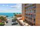 Relaxing condo balcony overlooking a pool, the bay, and a picturesque waterfront community at 7430 Sunshine Skyway S Ln # 402, St Petersburg, FL 33711
