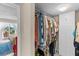 Walk-in closet with clothing racks, shelves, and storage cabinets for optimal organization at 7430 Sunshine Skyway S Ln # 402, St Petersburg, FL 33711
