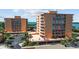 Condo complex with an outdoor patio area with seating and parking at 7430 Sunshine Skyway S Ln # 402, St Petersburg, FL 33711